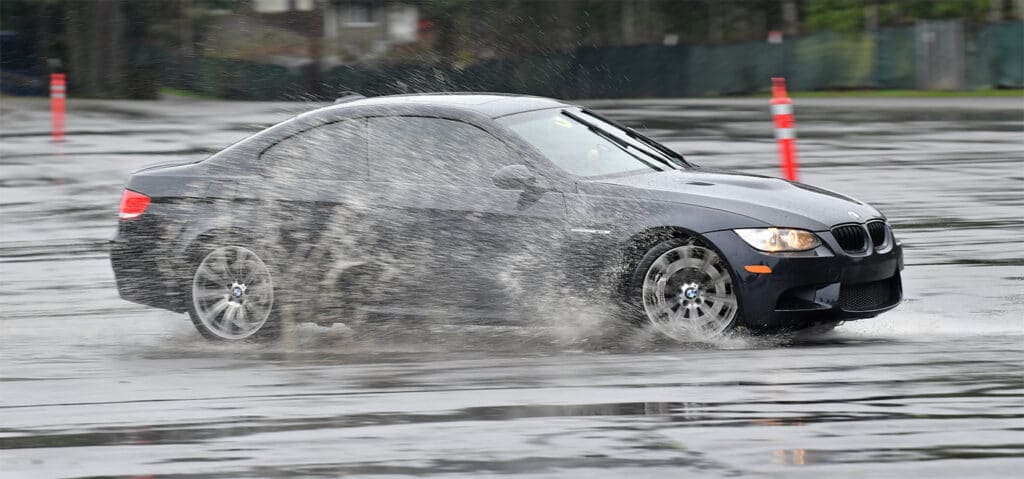 BMW skidding in rain during ProFormance Rain Driving Skills Clinic
