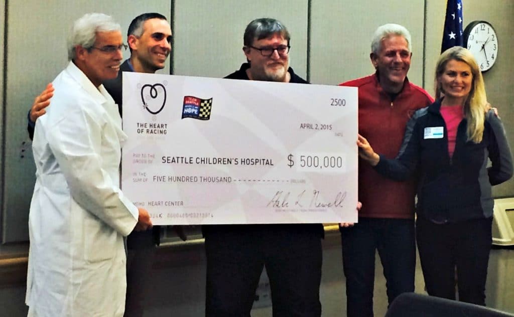 Don Kitch Gabe newell with check for children's hospital seattle