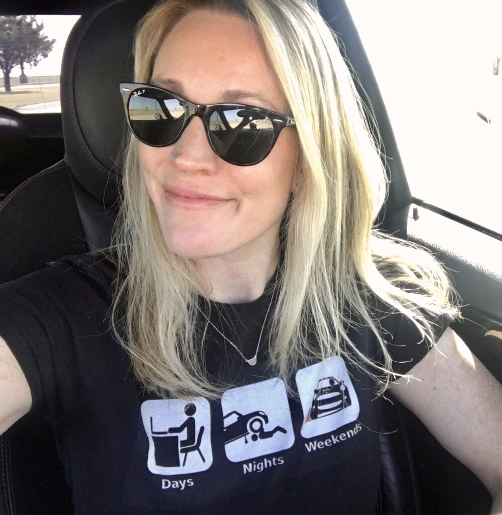 Michele Graaf in car with performance driving t-shirt