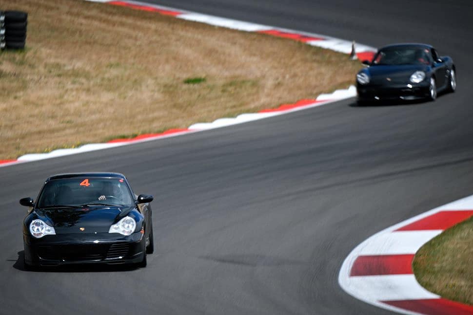 Phil Goeckler and Raelyn Raver driving their Porsches