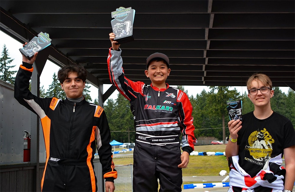 asad nikadaembaef showing first place award at psgka kart racing championships 2022