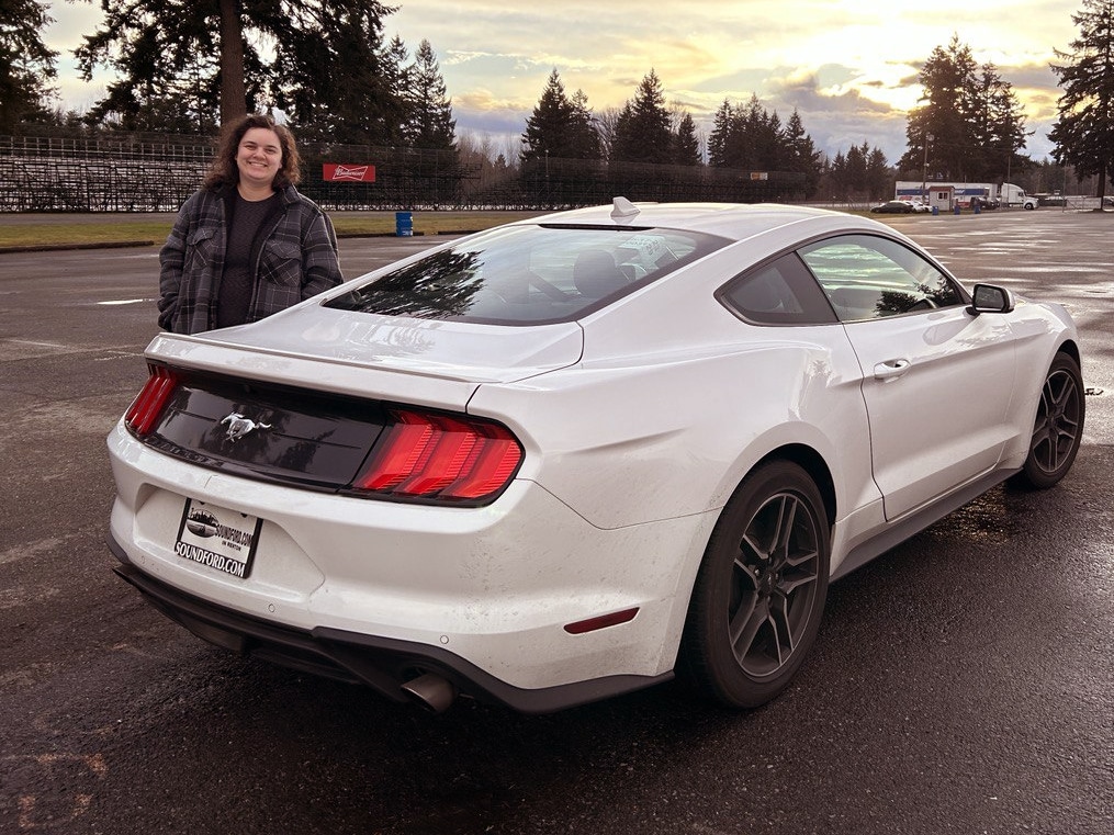 coopers garage founder Kara Cooper with her Mustang