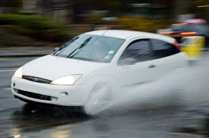 Car aquaplaning to demonstrate the hazards of winter driving