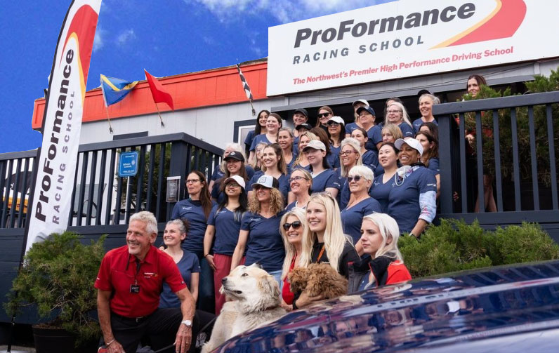 Women with ProFormance team in front of ProFormance Racing School at Women's Day 2024