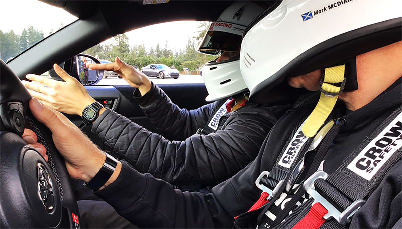 Racing coach coaches driver at ProFomance Racing School